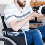 man wheelchair using vr
